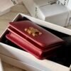 triomphe compact wallet in shiny calfskin Claret