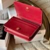 triomphe compact wallet in shiny calfskin Claret